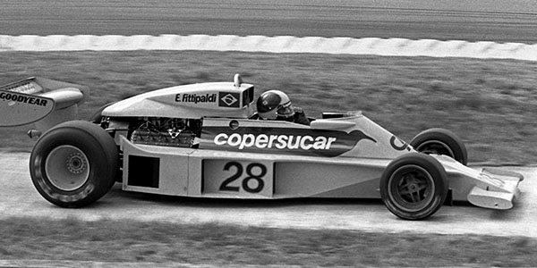 Emerson Fittipaldi in the Fittipaldi F5 at Silverstone in 1977 for the British Grand Prix. Copyright David Bishop 2018. Used with permission.