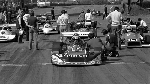 Phil Dowsett sits in his March 81A on the front row of the Grid at Oulton Park, April 1981. No 22 is Richard Hawkins in the Ralt RT1, No 3 is Ian Taylor's Tiga FA81, partly obscured behind Dowsett is Mark Thatcher in the Ehrlich RP5A and the No 15 is the sister Ehrlich RP5B of Ian Flux. Copyright Alan Cox 2010. Used with permission. Phil Dowsett sits in his March 81A on the front row of the Grid at Oulton Park, April 1981. No 22 is Richard Hawkins in the Ralt RT1, No 3 is Ian Taylor's Tiga FA81, partly obscured behind Dowsett is Mark Thatcher in the Ehrlich RP5A and the No 15 is the sister Ehrlich RP5B of Ian Flux. Copyright Alan Cox 2010. Used with permission.