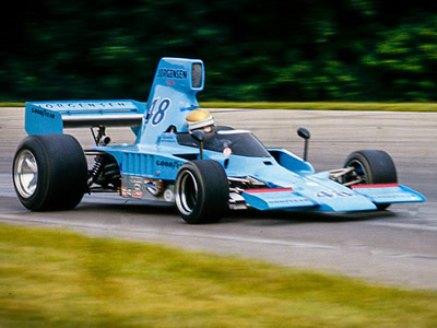 Vern Schuppan in AAR's Lola T332 at Mid-Ohio in 1976. Copyright Richard Deming 2016. Used with permission.