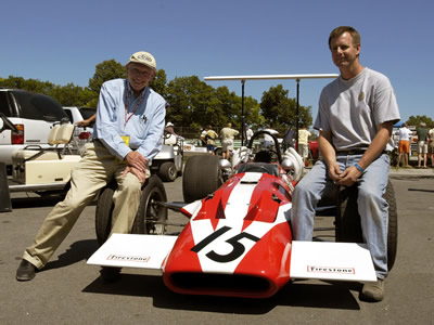Mark Harmer poses with John Surtees and his restored Surtees at Road America in the summer of 2003. Copyright Mark Harmer 2003. Used with permission.