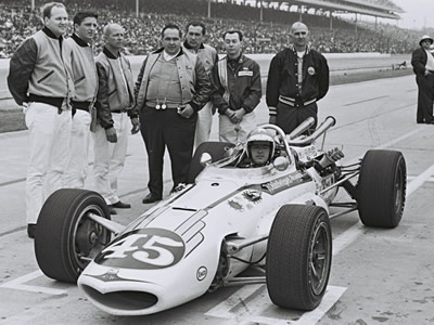 Johnny Rutherford in the Eagle with the Weinberger Homes crew at the 1967 Indy 500. Licenced by The Henry Ford under Creative Commons licence Attribution-NonCommercial-NoDerivs 2.0 Generic. Original image has been cropped.