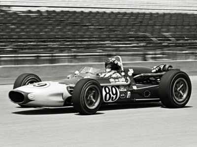 Ebb Rose's entered a #89 Racing Associates Gerhardt in practice for the 1967 Indy 500. Part of the Dave Friedman collection. Licenced by The Henry Ford under Creative Commons licence Attribution-NonCommercial-NoDerivs 2.0 Generic. Original image has been cropped.