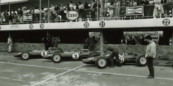 The Team Lotus 25s lined up for the 1963 Mexican GP; from left to right, Jim Clark's R4, Trevor Taylor's R6 and Pedro Rodriguez' R3. Part of the Dave Friedman collection. Licenced by The Henry Ford under Creative Commons licence Attribution-NonCommercial-NoDerivs 2.0 Generic. Original image has been cropped. The Team Lotus 25s lined up for the 1963 Mexican GP; from left to right, Jim Clark's R4, Trevor Taylor's R6 and Pedro Rodriguez' R3. Part of the Dave Friedman collection. Licenced by The Henry Ford under Creative Commons licence Attribution-NonCommercial-NoDerivs 2.0 Generic. Original image has been cropped.