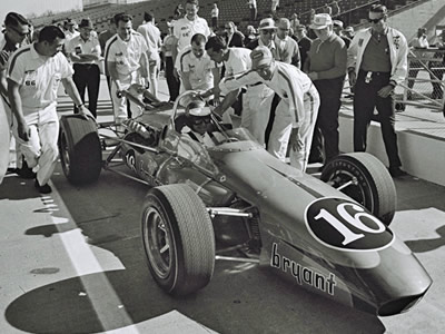 Len Sutton prepares for practice in the 1965 Vollstedt at that year's Indy 500. Part of the Dave Friedman collection. Licenced by The Henry Ford under Creative Commons licence Attribution-NonCommercial-NoDerivs 2.0 Generic. Original image has been cropped.