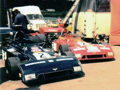 Tony Dean's two Chevron B24s at Mallory Park in July 1974: the blue car is his original B24-73-01 and the red car is the ex-Gethin 'B24-73-08'. Copyright Simon Lewis 2004. Used with permission.