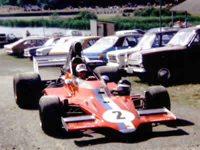 Peter Gethin's T400 HU4 being taken through the Mallory Park paddock in 1975. Copyright Simon Lewis 2004. Used with permission.