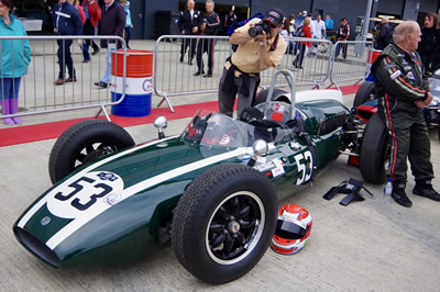 Scotty Taylor waits with his Cooper T53 at the 2017 Silverstone Classic. Licenced by David Merrett under Creative Commons licence Attribution 2.0 Generic (CC BY 2.0). Original image has been cropped.