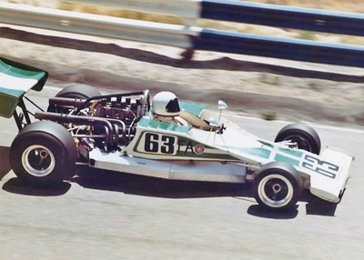 Eddy O'Brien in his Lola T300 at Laguna Seca, probably in 1974.  Note the added deformable structures. Copyright Vincent Puleo 2016. Used with permission.