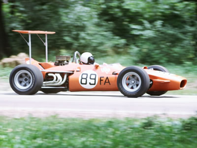 John Hood's oddly orange Lola T140 at Blackhawk Farms in July 1969. Copyright Tom Schultz 2006. Used with permission.