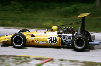 Another 'Golden Yellow' Lola T142, this one with John Gunn aboard at Road America in July 1969. Copyright Tom Schultz 2006. Used with permission.