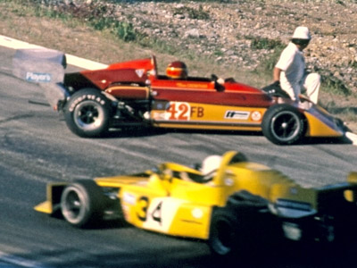 Tom Crowther pointing the wrong way in his Falconer-bodied March 722 at Westwood in May 1975, as Tom Pumpelly passes by in the foreground. Copyright Kevin Skinner 2020. Used with permission.