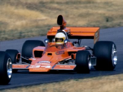 An orange Lola T330 wearing 34 at Road America in 1976 but is it Lazier or