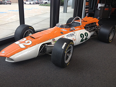 Wally Dallenbach's 1966 Eagle in the lobby of <a href=http://unserkarting.com/ target=_blank>Unser Karting</a> in July 2014. Copyright Unser Karting 2014. Used with permission.