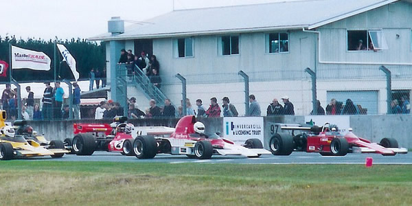 The cars line up for the start of the 2004 Classic Speed Fest, with Mike Wrigley's #97 Lola on pole and Murray Sinclair's Lola T332 alongside.  Copyright Kevin Thomson 2004.  Used with permission.