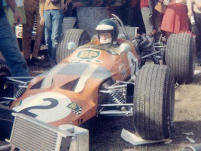 Jochen Rindt in the paddock at the 1969 Albi Grand Prix in his Lotus 59B. Copyright Gerard Barathieu 2020. Used with permission.