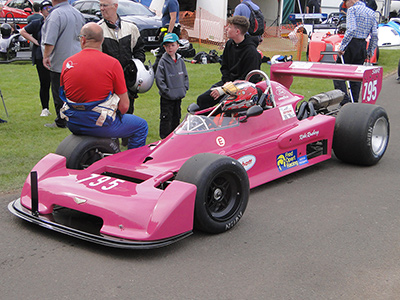 Nicola Menzies in her father George Coghill's Chevron B45 at Doune in June 2023 (George is standing next to the car, holding a helmet). Copyright John Brown 2023. Used with permission.