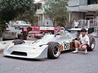 A young Ricky Chong with his father Chong Boon Seng's Chevron B29. Copyright Ricky Chong 2022. Used with permission.