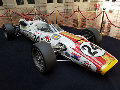 The replica #24 Lola T90 on display at the Hop Exchange in London in May 2019. Licenced by Flickr user 'Sarflondondunc' under Creative Commons licence Attribution-NonCommercial-NoDerivs 2.0 Generic. Original image has been cropped.