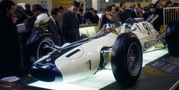 Dan Gurney's #91 Lotus 29, the car he had damaged in practice at the Indy 500, on display at the Racing Car Show at Olympia in London in January 1964 after Lotus rebuilt it. Copyright Gary Critcher 2019. Used with permission.