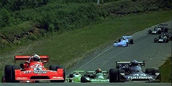 Bill Brack (Chevron B29) and Elliot Forbes-Robinson (Lola T360) lead the parade lap at Mont-Tremblant in Jul 1975.  Copyright Allan De La Plante 2012.  Used with permission.