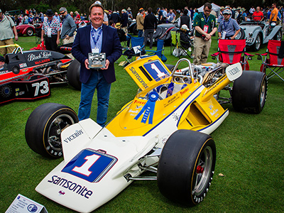 A beaming Chuck Jones with his Parnelli VPJ1 at Amelia Island in 2018. Copyright Richard Deming 2018. Used with permission.