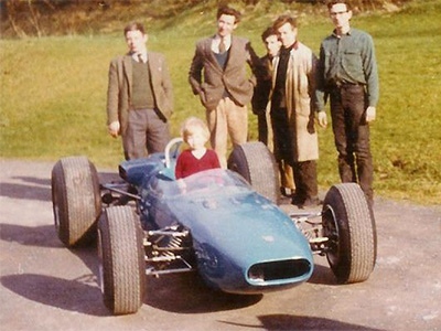 Bruce Klussmann picking up his Crosslé 12F at the factory in 1967. Behind and in the car from left to right are Leslie Drysdale, Henry and John Crosslé, Alfie Wilson, Ian Drysdale and Bruce Klussmann. Copyright Alan Drysdale 2010. Used with permission.
