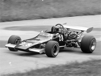 Tom Mangan in his Crosslé 28F, probably at Road America in 1974. Copyright Ted Walker 2024. Used with permission.
