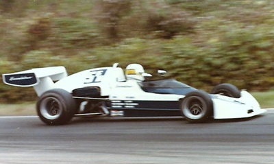 Rick Koehler in his "Excalibur EE1B" at the 1977 SCCA Runoffs. Copyright Peter Viccary (<a href='http://www.gladiatorroadracing.ca/' target='_blank'>gladiatorroadracing.ca</a>) 2021. Used with permission.