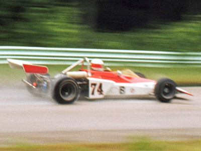 Dan Carmichael's Brabham BT40 on the Kettle Moraine Straight in the rain at the 1974 Road America June Sprints. Copyright John Hallman 2021. Used with permission.