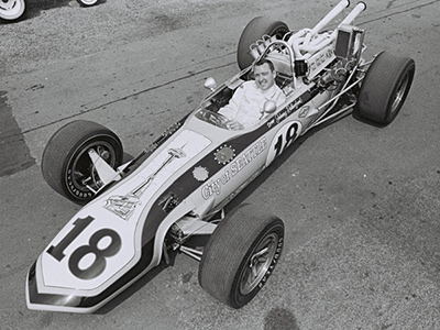 Johnny Rutherford poses in Alan Green's City of Seattle Eagle at the Indy 500 in 1968. Licenced by The Henry Ford under Creative Commons licence Attribution-NonCommercial-NoDerivs 2.0 Generic. Original image has been cropped.