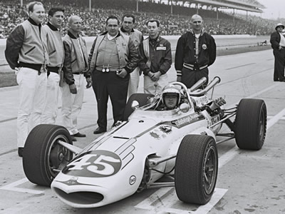Johnny Rutherford in the Eagle with the Weinberger Homes crew at the 1967 Indy 500. Licenced by The Henry Ford under Creative Commons licence Attribution-NonCommercial-NoDerivs 2.0 Generic. Original image has been cropped. Johnny Rutherford in the Eagle with the Weinberger Homes crew at the 1967 Indy 500. Licenced by The Henry Ford under Creative Commons licence Attribution-NonCommercial-NoDerivs 2.0 Generic. Original image has been cropped.