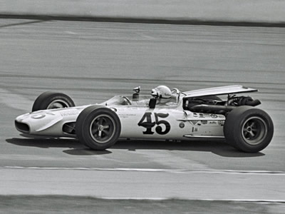 Ronnie Bucknum on track in the Weinberger Homes Eagle at the 1969 Indy 500. Part of the Dave Friedman collection. Licenced by The Henry Ford under Creative Commons licence Attribution-NonCommercial-NoDerivs 2.0 Generic. Original image has been cropped.