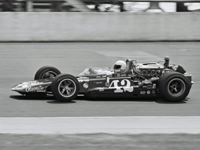 Denny Hulme in his #42 Olsonite Eagle at the 1969 Indy 500. Part of the Dave Friedman collection. Licenced by The Henry Ford under Creative Commons licence Attribution-NonCommercial-NoDerivs 2.0 Generic. Original image has been cropped.