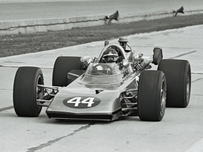 Joe Leonard in Smokey Yunick's City of Daytona Beach Eagle at the 1969 Indy 500. Part of the Dave Friedman collection. Licenced by The Henry Ford under Creative Commons licence Attribution-NonCommercial-NoDerivs 2.0 Generic. Original image has been cropped.