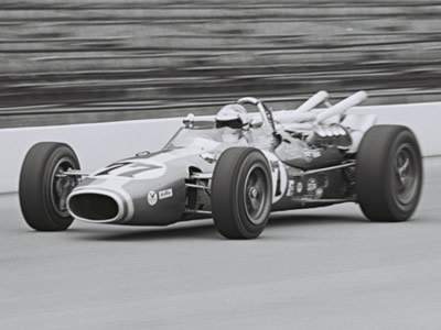 Bruce Jacobi in George Walther's Dayton Steel Brake Gerhardt at the Indy 500 in 1967. Part of the Dave Friedman collection. Licenced by The Henry Ford under Creative Commons licence Attribution-NonCommercial-NoDerivs 2.0 Generic. Original image has been cropped. Bruce Jacobi in George Walther's Dayton Steel Brake Gerhardt at the Indy 500 in 1967. Part of the Dave Friedman collection. Licenced by The Henry Ford under Creative Commons licence Attribution-NonCommercial-NoDerivs 2.0 Generic. Original image has been cropped.