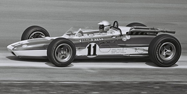 Chuck Stevenson in #11 Vita-Fresh Orange Juice Huffaker at the Indy 500 in 1966. Licenced by The Henry Ford under Creative Commons licence Attribution-NonCommercial-NoDerivs 2.0 Generic. Original image has been cropped.