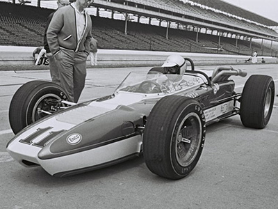 Chuck Stevenson in #11 Vita-Fresh Orange Juice Huffaker at the Indy 500 in 1966. Licenced by The Henry Ford under Creative Commons licence Attribution-NonCommercial-NoDerivs 2.0 Generic. Original image has been cropped.
