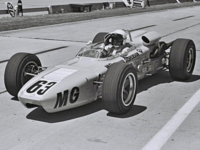Bob Veith in Kjell H Qvale's #63 MG Liquid Suspension Huffaker at the Indy 500 in 1966. Licenced by The Henry Ford under Creative Commons licence Attribution-NonCommercial-NoDerivs 2.0 Generic. Original image has been cropped.
