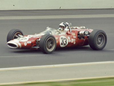 Peter Revson in George Walther's Lola T90 at the 1967 Indy 500. Licenced by The Henry Ford under Creative Commons licence Attribution-NonCommercial-NoDerivs 2.0 Generic. Original image has been cropped.