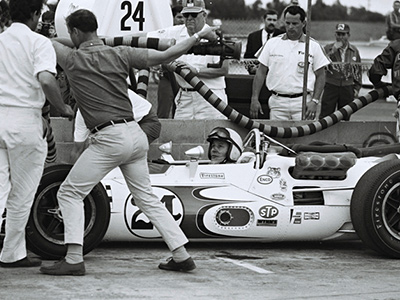 John Surtees in the Bowes Seal Fast Lola T92 at Riverside in November 1967. Licenced by The Henry Ford under Creative Commons licence Attribution-NonCommercial-NoDerivs 2.0 Generic. Original image has been cropped.