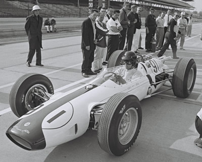 Dan Gurney takes the #91 Lotus 29, his intended race car, out to practice at the Speedway in 1963.  Part of the Dave Friedman collection. Licenced by The Henry Ford under Creative Commons licence Attribution-NonCommercial-NoDerivs 2.0 Generic. Original image has been cropped.