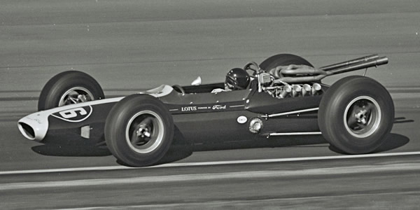 Jim Clark in his #6 Lotus 34 race car at the 1964 Indy 500. Part of the Dave Friedman collection. Licenced by The Henry Ford under Creative Commons licence Attribution-NonCommercial-NoDerivs 2.0 Generic. Original image has been cropped.