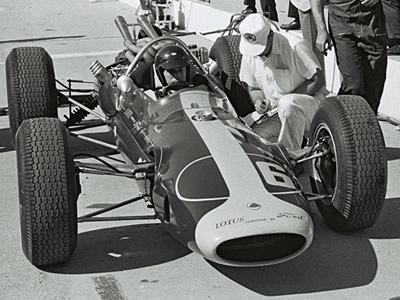 Jim Clark in his #6 Lotus 34 in the pits during practice for the 1964 Indy 500. Part of the Dave Friedman collection. Licenced by The Henry Ford under Creative Commons licence Attribution-NonCommercial-NoDerivs 2.0 Generic. Original image has been cropped.