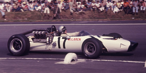 Bruce McLaren in the McLaren M2B with Indy Ford engine at the Mexican Grand Prix in 1966. Licenced by The Henry Ford under Creative Commons licence Attribution-NonCommercial-NoDerivs 2.0 Generic. Original image has been cropped.
