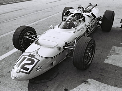 Chuck Hulse in the 1966 Watson at the 1966 Indianapolis 500.  Part of the Dave Friedman collection. Licenced by The Henry Ford under Creative Commons licence Attribution-NonCommercial-NoDerivs 2.0 Generic. Original image has been cropped.