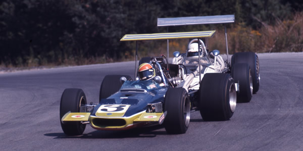Bobby Brown leads Tony Adamowicz in their high-wing Eagles at Mosport in 1969.  Copyright Thomas Horat 2010.  Used with permission.