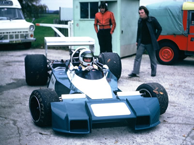 Keith Holland takes the Trojan T102 out for its first test, with Patrick Head following on, and Holland's mechanic Mick Kerr keeping his distance. Copyright Ken Hyndman 2018. Used with permission. Keith Holland takes the Trojan T102 out for its first test, with Patrick Head following on, and Holland's mechanic Mick Kerr keeping his distance. Copyright Ken Hyndman 2018. Used with permission.