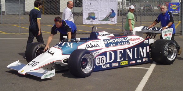 Frank Lyons' Osella FA1B/81 is wheeled into the marshalling area for the Masters F1 race at the 2010 Silverstone Classic. Copyright Keith Lewcock 2017. Used with permission.