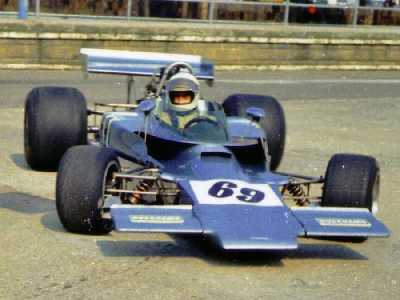 Clive Santo in Lola T330 HU21 in the Silverstone pitlane in 1974. Copyright Simon Lewis 2004. Used with permission.