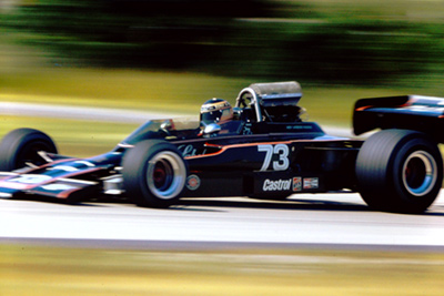 Tony Adamowicz in his Carling Black Label Lola T330 at Road America in 1973. Copyright Frank Meinert 2021. Used with permission.
